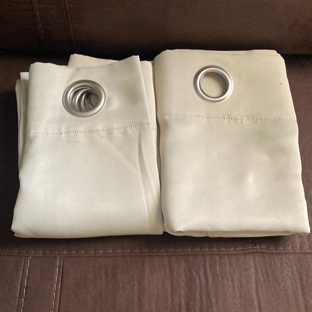 Pair of beige grommet curtains. 40x84.